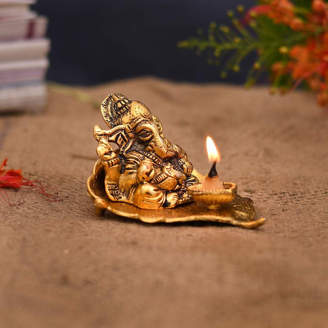 Antique Ganesh Idol on Leaf with Diya